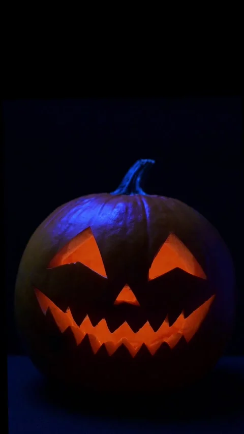 Glowing Jack-o'-Lantern with Light Inside for Halloween Stock Footage 345093561