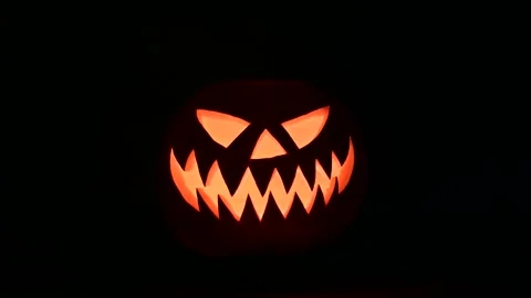 Glowing jack-o-lantern lit from inside Stock Footage 317674815