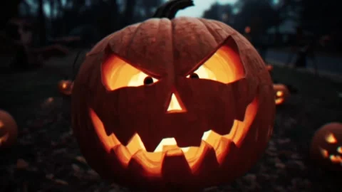 Glowing Jack O Lantern Pumpkin in a Dark Forest with Flickering Light Stock Footage 342341968