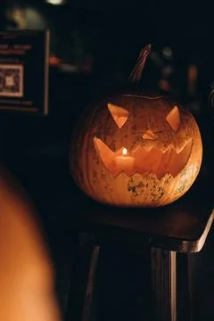 Glowing Jack-o'-lantern pumpkin with scary face for Halloween decoration Stock Photos