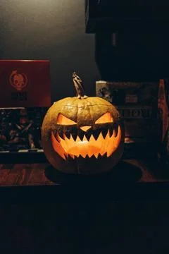 Glowing Jack-o'-lantern pumpkin with scary face for Halloween decoration Stock Photos