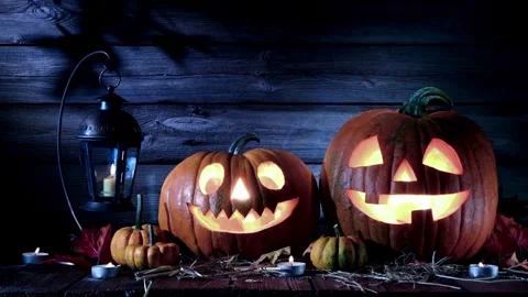 Glowing Jack o lantern pumpkins for Halloween night Stock Footage 334104842