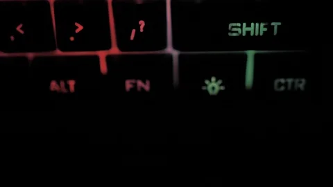 Glowing keyboard hackier style glittering at the night workplace with different 動画素材 90314311