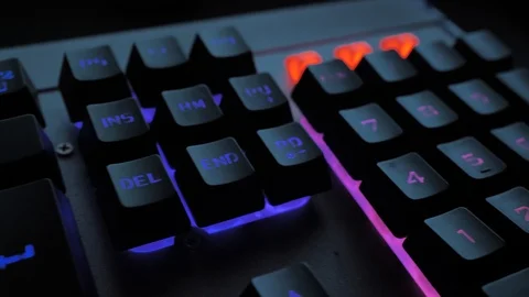 Glowing keyboard hackier style glittering at the night workplace with different Stock Footage 90388550