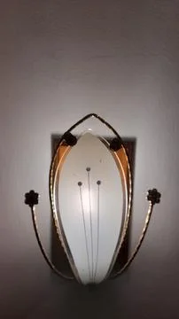 Glowing lamp on the wall Stock Photos