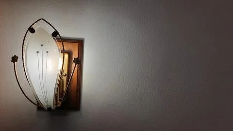 Glowing lamp on the wall Stock Photos