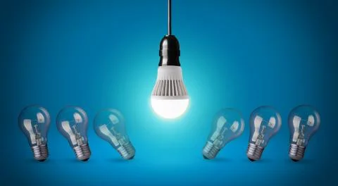 Glowing led bulb and simple light bulbs Stock Photos