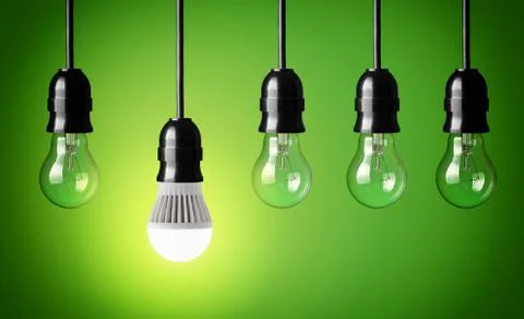 Glowing led bulb and simple light bulbs Stockfoto's