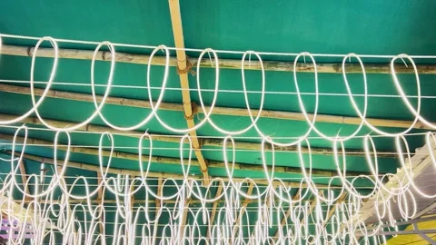 Glowing LED String Lights Hanging From Bamboo Tent Structure Stock Footage 346687712