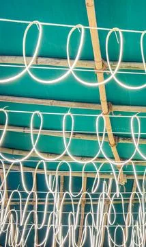 Glowing LED String Lights Hanging From Bamboo Tent Structure Stock Photos