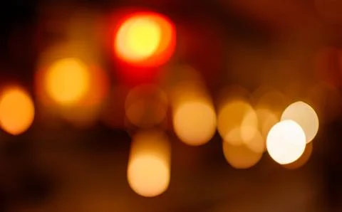 Glowing light bokeh effect with warm tones Stock Photos