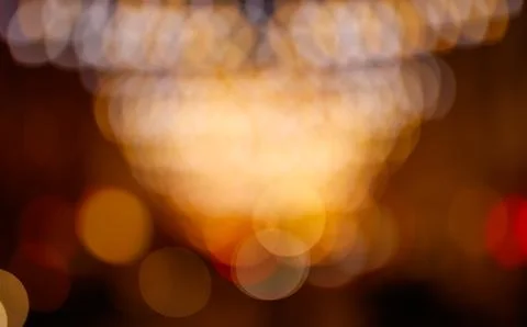 Glowing light bokeh effect with warm tones Stock Photos