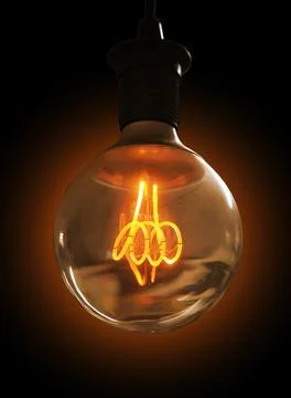 Glowing light bulb on dark background Stock Photos