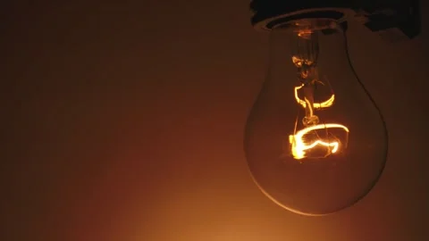 Glowing Light Bulb in Dark Room Close Up 스톡 동영상 329763356