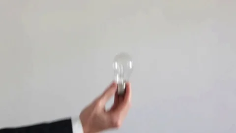Glowing light bulb in hand. Stock Footage 71297064