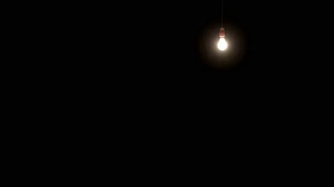 Glowing light bulb is hanging dark black background. 3D Seamless footage. Stock Footage 146936199