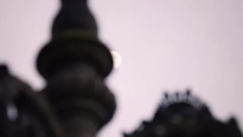 Glowing Light Emerging Behind an Ornate Lamppost in Slow Motion Stock Footage 341670210
