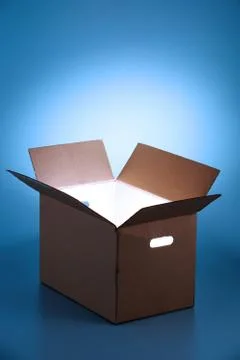Glowing  light from open box Stock Photos