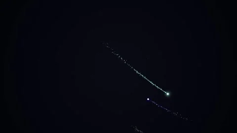 Glowing light trails across dark background of space Stock-Footage 331643645