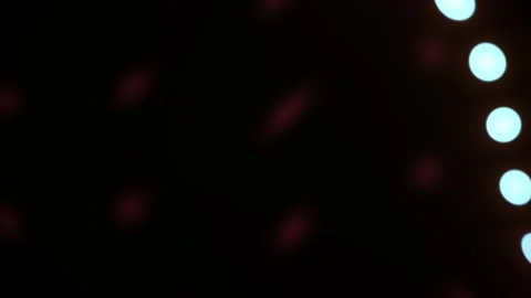 Glowing lights on dark background with bokeh effect. Stock Footage 337467048