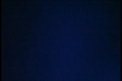 Glowing Lights On Dark Wall - A - 720x480 - 1 minute loop Stock Footage 33303926