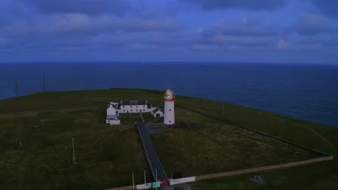 Glowing Loop Head Lighthouse Aerial with Ocean Views Stock Footage 291557595