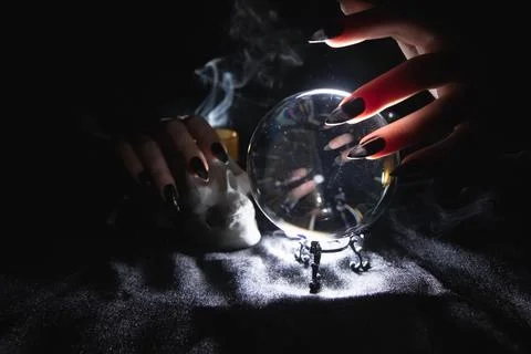 Glowing magic ball, skull and smoke in the dark Stock Photos