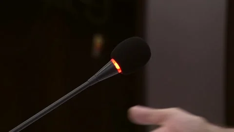 Glowing microphone on a black background Видео 324766507