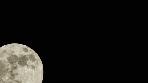 Glowing moon time lapse in the night sky. full moon timelapse. Video stock 228855159