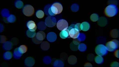 Glowing multicolored lights on a black background. Bokeh effect. Stock Footage 145206036