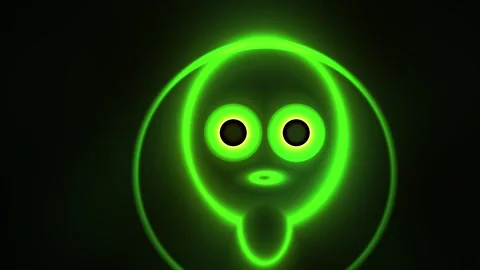Glowing Neon Alien Face Animation with Pulsing Light Effects. Stock Footage 334526627