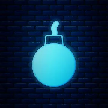 Glowing neon Bomb ready to explode icon isolated on brick wall background. .. 스톡 일러스트