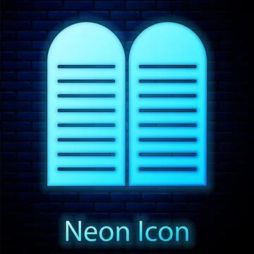 Glowing neon The commandments icon isolated on brick wall background. Gods law Stock Illustration