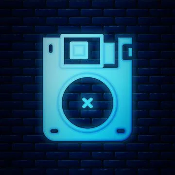 Glowing neon Floppy disk for computer data storage icon isolated on brick wall Illustrazione stock