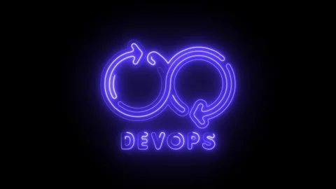 Glowing neon infinity loop icon with devops text below isolated on black ba.. Stock Footage 314712834