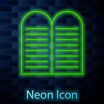 Glowing neon line The commandments icon isolated on brick wall background. Gods Illustrazione stock