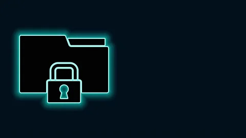 Glowing neon line Folder and lock icon isolated on black background. Closed Video stock 147225835