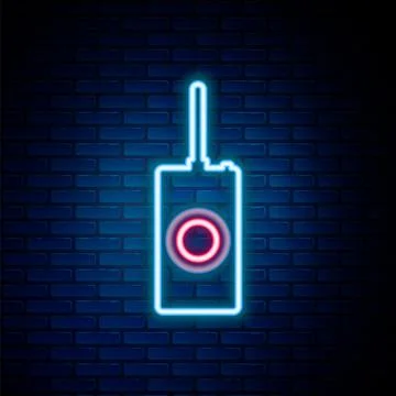 Glowing neon line Remote control icon isolated on brick wall background Illustrazione stock