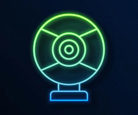 Glowing neon line Security camera icon isolated on blue background. Vector Illustrazione stock