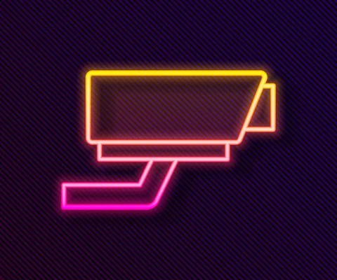 Glowing neon line Security camera icon isolated on black background. Vector Illustrazione stock
