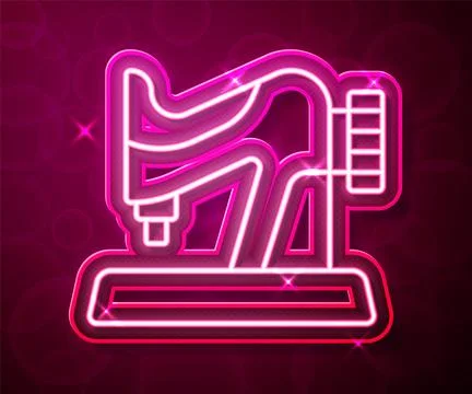 Glowing neon line Sewing machine icon isolated on red background. Vector Illustrazione stock