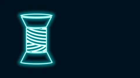 Glowing neon line Sewing thread on spool icon isolated on black background. Yarn Stock Footage 141400845