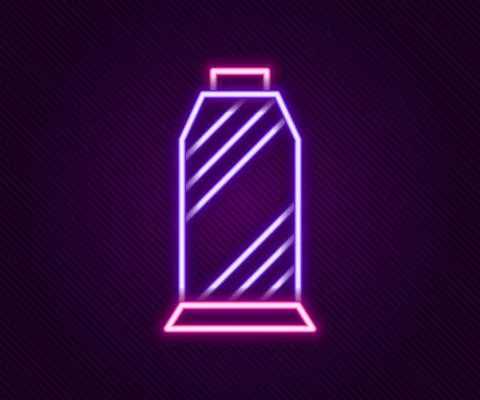 Glowing neon line Sewing thread on spool icon isolated on black background. Yarn Stock Illustration