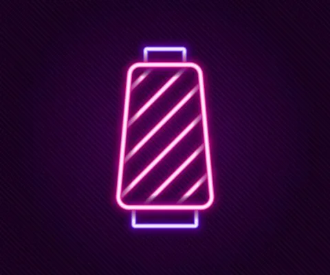 Glowing neon line Sewing thread on spool icon isolated on black background. Yarn Illustrazione stock