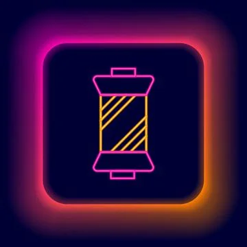 Glowing neon line Sewing thread on spool icon isolated on black background. Yarn Illustrazione stock