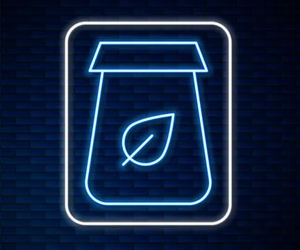 Glowing neon line Tea packaging icon isolated on brick wall background. Pap.. Stock Illustration