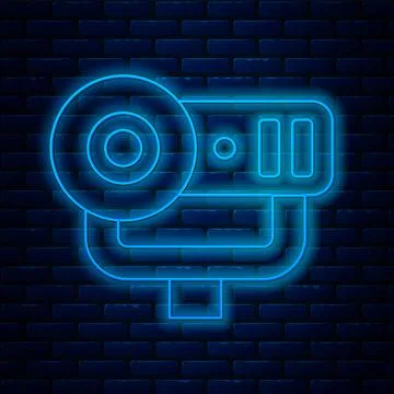 Glowing neon line Web camera icon isolated on brick wall background. Chat camera Illustrazione stock