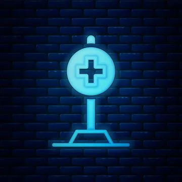 Glowing neon Medical map pointer with cross hospital icon isolated on brick wall 스톡 일러스트
