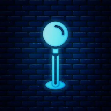 Glowing neon Push pin icon isolated on brick wall background. Thumbtacks sign Stock Illustration