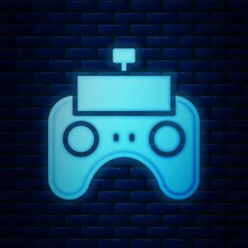 Glowing neon Remote control icon isolated on brick wall background. Vector Illustrazione stock